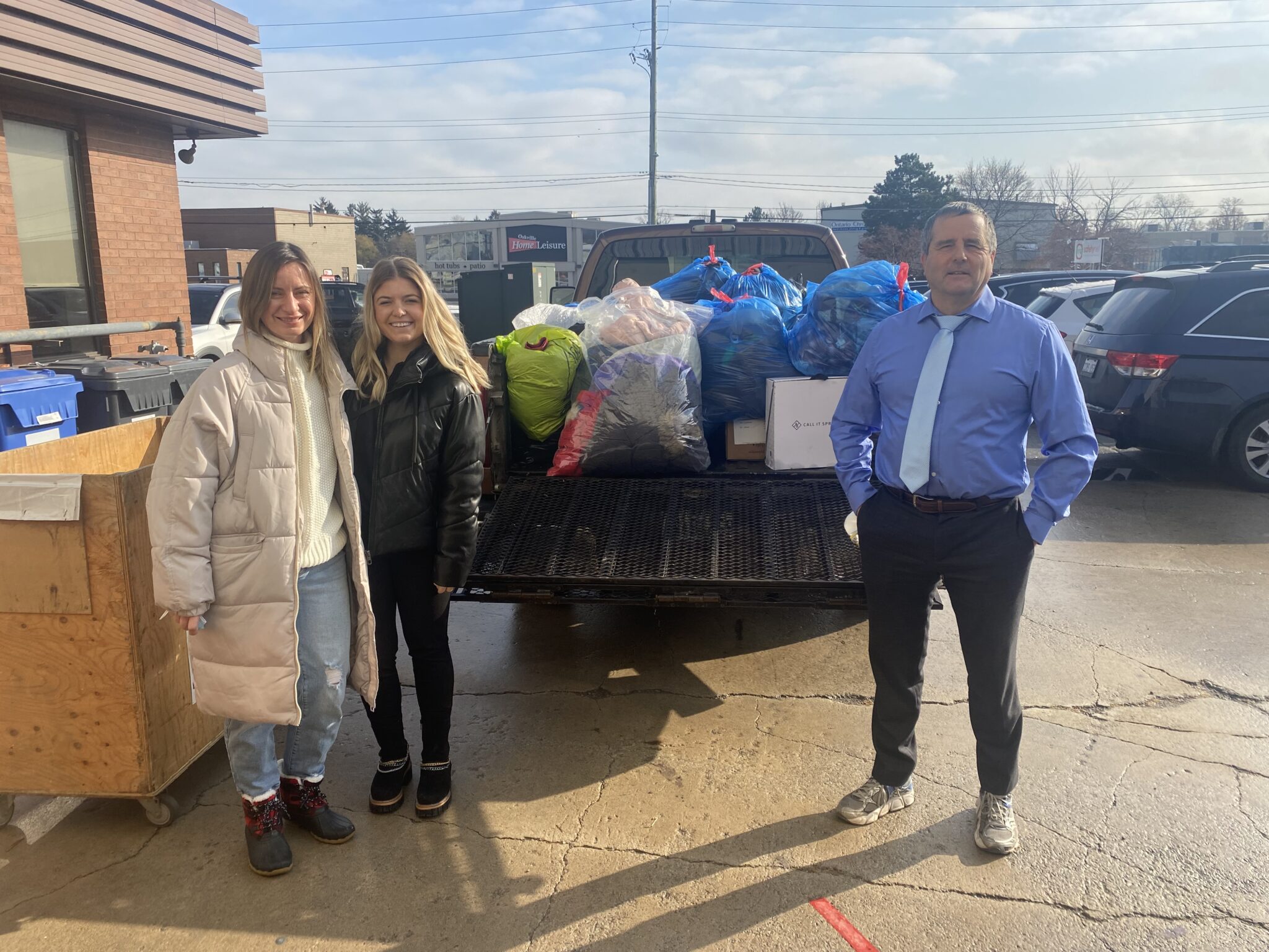 Kate Czaplinska and Angelica Banas ready to send off a truck full of coats