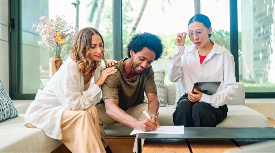 Stock photo of a couple with real estate agent.